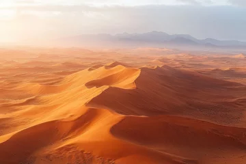 A vast desert landscape with large golden sand dunes under soft sunlight and hazy mountains in the background, evoking a serene and expansive atmosphere