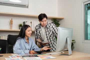 UX and UI Design Discussion. Young designers collaborating on digital project in modern office.