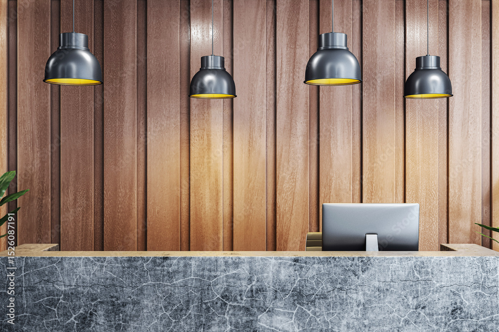 Poster modern reception desk with computer on marble counter under pendant lights in wooden panel office in