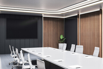 Modern luxury boardroom interior with sleek furniture, large desk, wall display, wood panels and bright lighting in corporate workspace. 3D Rendering