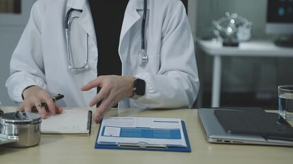 Male patient having consultation with doctor or psychiatrist who working on diagnostic examination on men's health disease or mental illness in medical clinic or hospital mental health service center