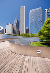 Sunny view of downtown Chicago with iconic skyscrapers rising above a Millennium park