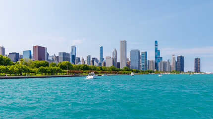 Bright and sunny view of downtown Chicago with the shimmering Michigan lake in the foreground