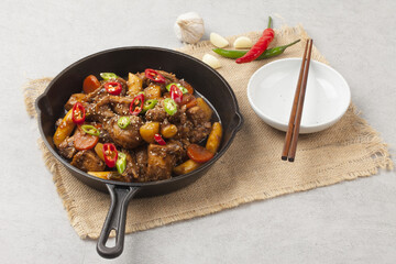  Jjimdak is a dish made by simmering chicken pieces with carrots, potatoes, garlic, peppers, green...