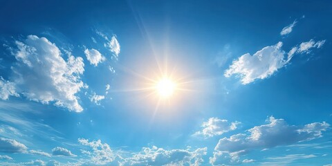 Bright sun shining in a clear blue sky with scattered white fluffy clouds creating a peaceful and uplifting atmosphere
