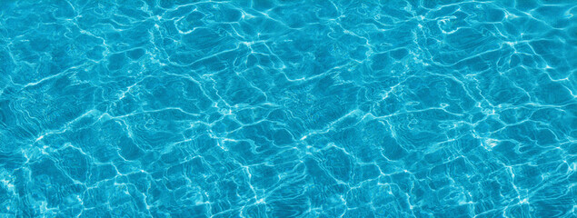 Turquoise and blurry sea waves. Dark grainy background.