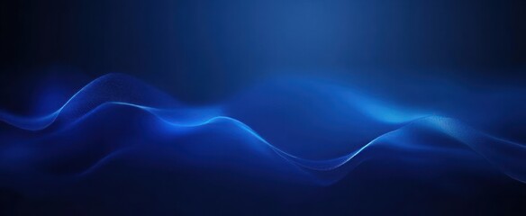 Obraz premium Smooth flowing blue wave pattern on dark background creating a calming and futuristic abstract visual