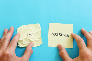 The word impossible is divided into two parts. success and challenge concept.