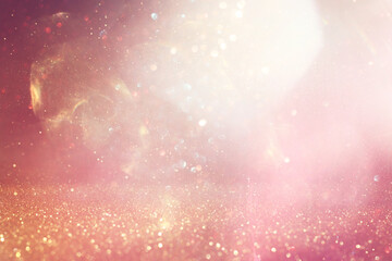 abstract glitter pink and gold lights background. de-focused