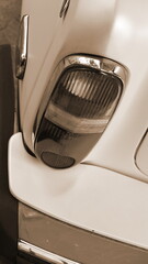 Vintage Car Tail Light Closeup Retro Detail Sepia Vertical Frame View. Classic Automobile Rear Lamp Macro Shot With Warm Toned Artistic Color