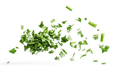 Chopped dry parsley leaves lift gracefully into the air against a clean, white background showcasing their vibrant green color and delicate texture during culinary preparation