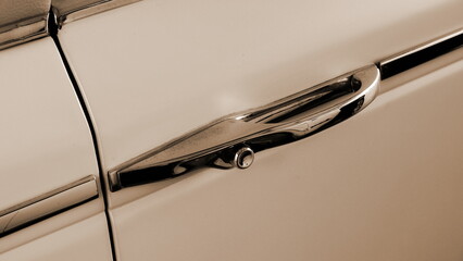 Vintage Car Door Handle Close Up in Sepia Tone with Soft Light