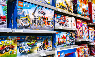 Obraz premium Sets of Lego construction toys displayed on store shelves