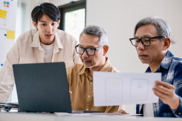 Asian Instructor Teaching Senior in Software Programming and Training Collaboration