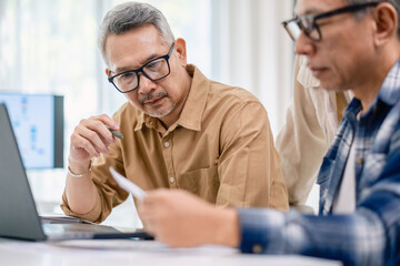 Asian Instructor Teaching Senior in Software Programming and Training Collaboration