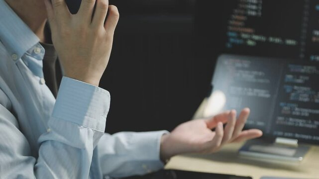 Young adult Asian female software developer coding program on desktop computer. Woman work from home, remote working, freelance programmer job, smart digital nomad lifestyle concept. Close Up