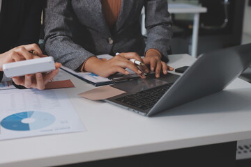 Accounting company provide finance and taxation planning for profitable cash flow, Auditor and accountant team working in office, analyze financial data and accounting record with calculator.Insight