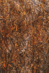 Oriented strand board (OSB) surface as background, brown painted wood