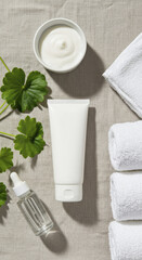 Overhead View of Centella Cream Tube with Cosmetics and Towels on Linen Fabric