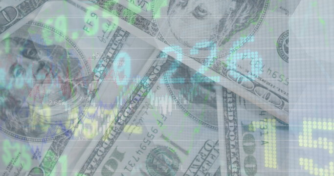 Image of financial data and graphs over dollars