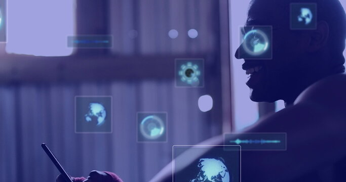 Image of digital screens with data over hands of african american man using smartphone