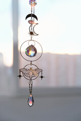 decor of Crystal prisms, crystal suncatcher on abstract light background. Magic Ritual, crystal practice for positive spirit, harmony, calming soul, productive the mind. Feng Shui, reiki energy