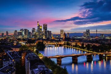 Elevated view of the illuminated skyline of Frankfurt am Main in Germany during a colorful summer evening