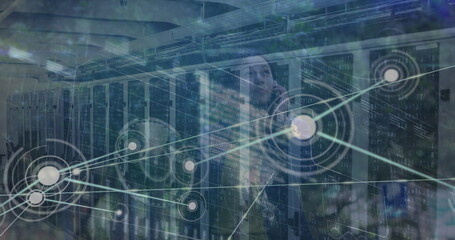 Image of network of connections over african american businesswoman talking on smartphone