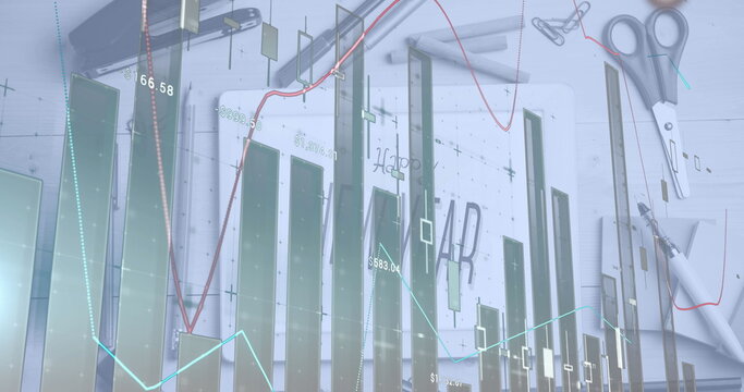 Image of graphs over digital tablet with happy new year drawing and stationery on table