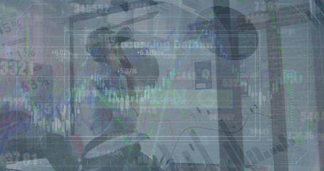 Image of data processing over caucasian businessman using vr headset at office