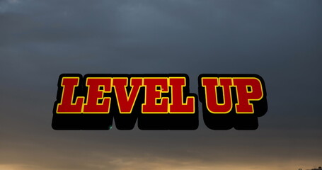 Image of level up text banner against sunset sky