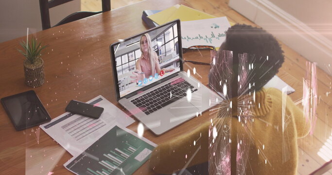 Image of connections and shapes over african american woman having image call on laptop