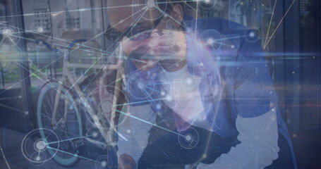 Image of network of connections over woman wearing vr headset