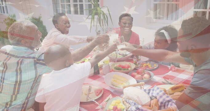 Image of flag of usa over african american family having dinner