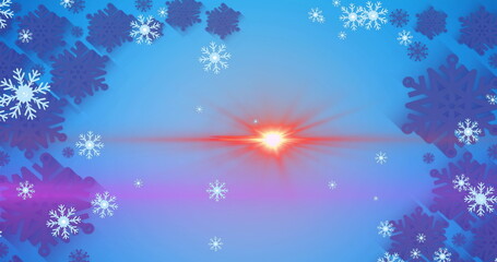 Image of light spots over snow falling