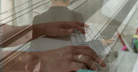 Image of hands using computer over caucasian businessman at airport