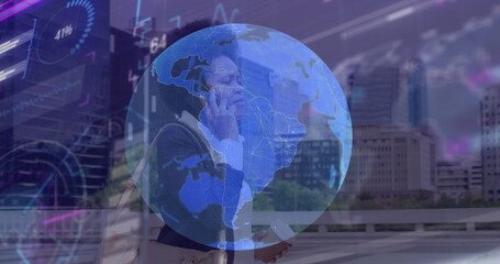 Image of globe and data processing over african american businesswoman talking on smartphone