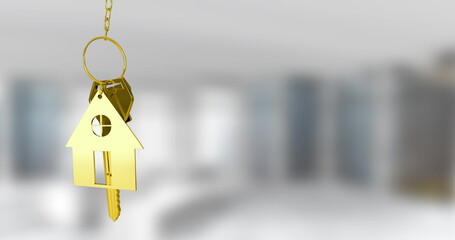 Image of golden house keys hanging against blurred background with copy space