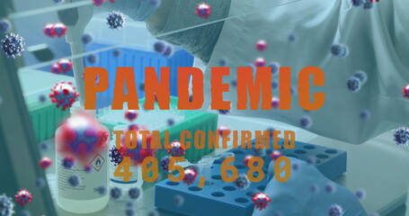 Image of virus cells and pandemic text over caucasian doctor