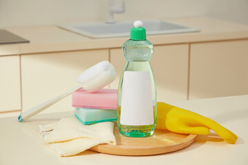 Dish soap, gloves, and sponges stacked together, combining functionality with soft natural light and pastel tones. Mockup bottle for design and advertising