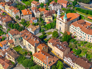 Aerial view of the central part of Volosko with a prominent twin-towered church, traditional...