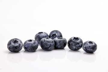 Fresh ripe whole blueberries on white background blue berry