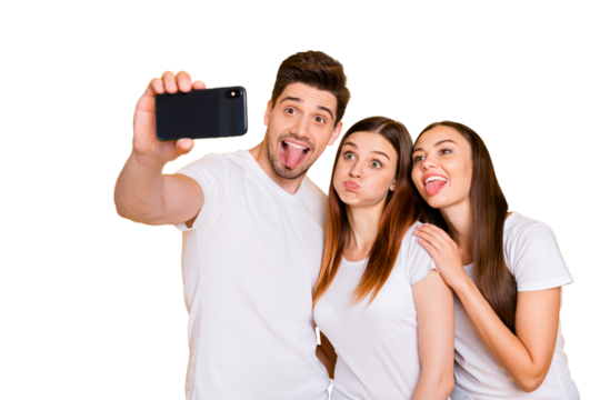 Portrait of three nice attractive lovely charming cute cheerful cheery playful comic dumb person taking making selfie having fun isolated over bright vivid shine yellow background