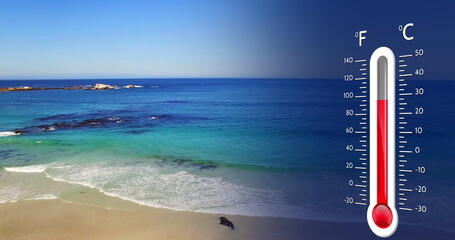 Image of digital thermometer over sea landscape