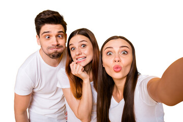 Self-portrait of three nice attractive lovely crazy cheerful cheery positive playful person sending you kiss having fun fooling isolated over bright vivid shine yellow background