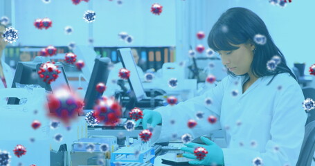 Image of virus cells over diverse doctors