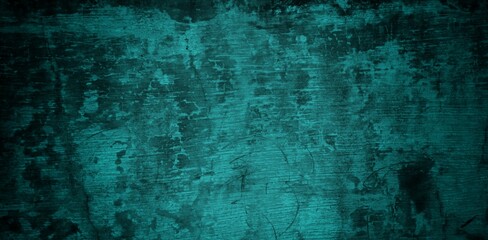  A textured background featuring a deep teal color with a distressed, grunge appearance. The surface shows variations in tone and subtle patterns, creating an abstract and moody aesthetic.
