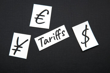 Dollar, euro and yen currency symbols, tariffs.