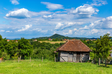 Fototapeta premium A traditional wooden barn in the hilly region of western Serbia.