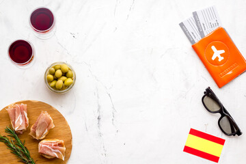 Travel to Spain. Passport and airplane tickets with traditional Spanish meal